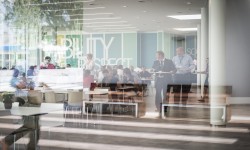 AirPlus cafeteria at lunchtime, employees enjoying their break in a lively atmosphere.