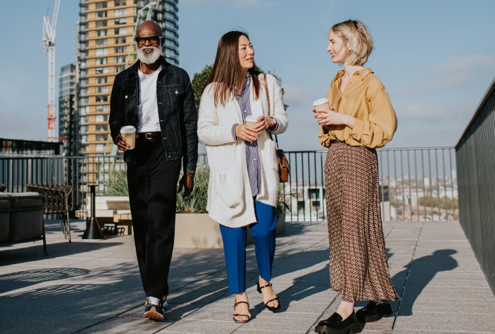 Three AirPlus employees enjoy a chat in the fresh air and their benefits.